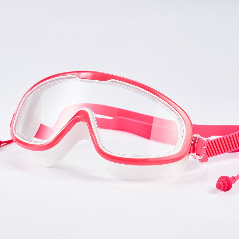 Child with earplugs and goggles