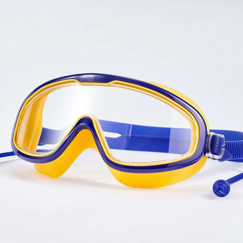 Child with earplugs and goggles